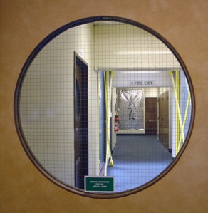 Installation view of 'The wanderer retreats' in the corridors of the law Faculty